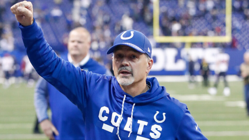 Former Indianapolis Colts head coach Chuck Pagano raises his first to the crowd following a win over the Houston Texans