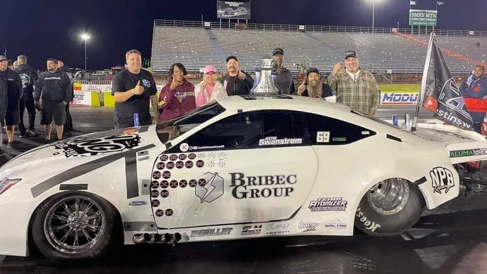 Street Outlaws No Prep Kings star Justin Swanstrom celebrating a win with his father Corey “Big Country” Swanstrom and his team after a No Prep Kings win