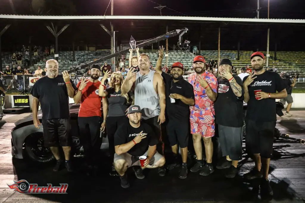 Street Outlaws No Prep Kings star Ryan Martin celebrates his win with his family and team after defeating John Odom in the final round of the Beech Bend Raceway event
