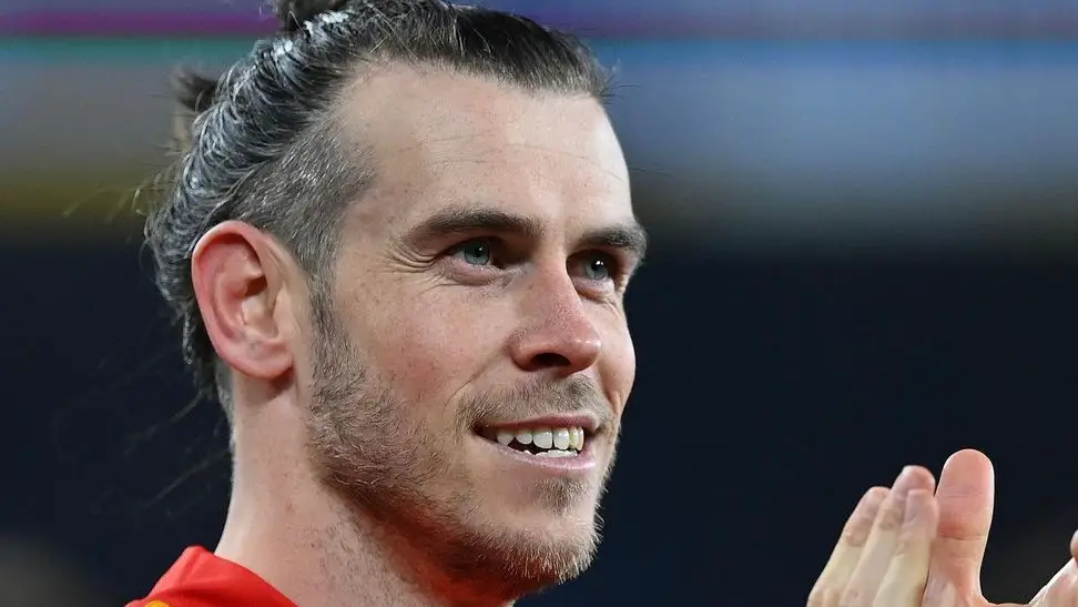 Soccer star Gareth Bale applauds the crowd at a game