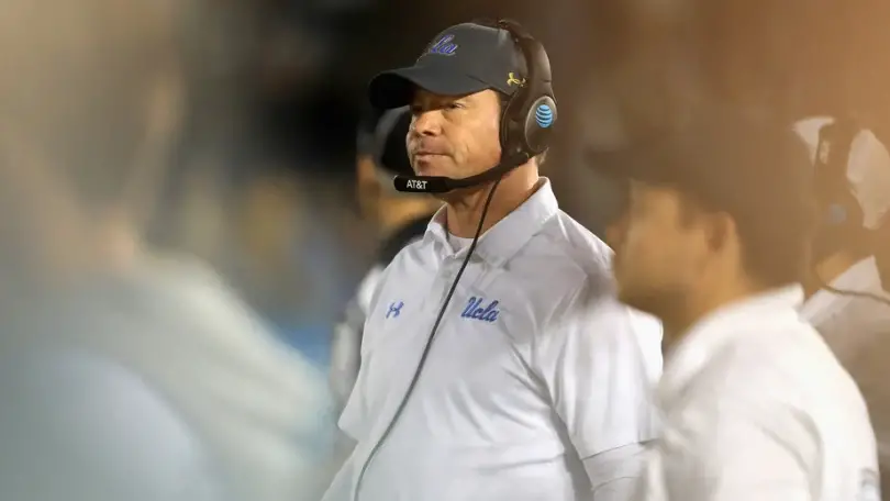 Former UCLA Bruins head coach Jim Mora Jr. looks on during a game