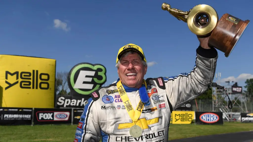 Legendary Funny Car driver John Force with the Wally after winning the Chevrolet Performance U.S. Nationals