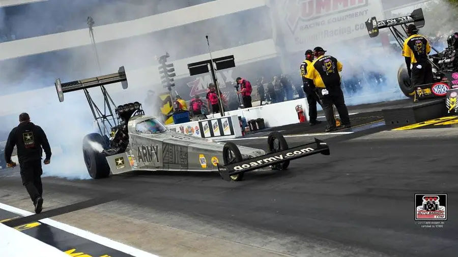 U.S. Army sponsored Top Fuel Dragster driver Tony Schumacher doing a burnout before making a pass at the national event at zMAX Dragway