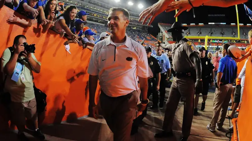 Former Florida Gators head coach Urban Meyer walks off the field into a tunnel at Ben Hill Griffin Stadium 