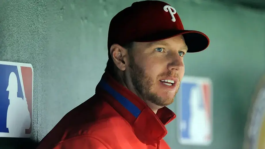 Philadelphia Phillies pitcher Roy Halladay watches the game from the dugout against the Washington Nationals