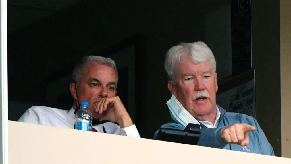 Former Kansas City Royals President of Baseball Operations Dayton Moore and owner John Sherman watch their team play against the Milwaukee Brewers in the first inning