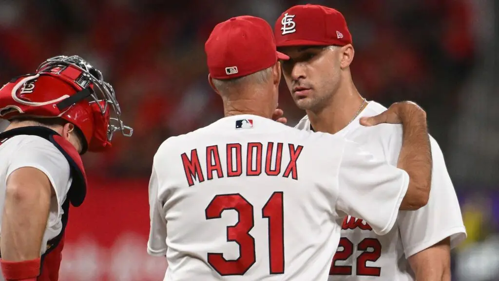 Former St. Louis Cardinals pitching coach Mike Maddux speaks with Jack Flaherty
