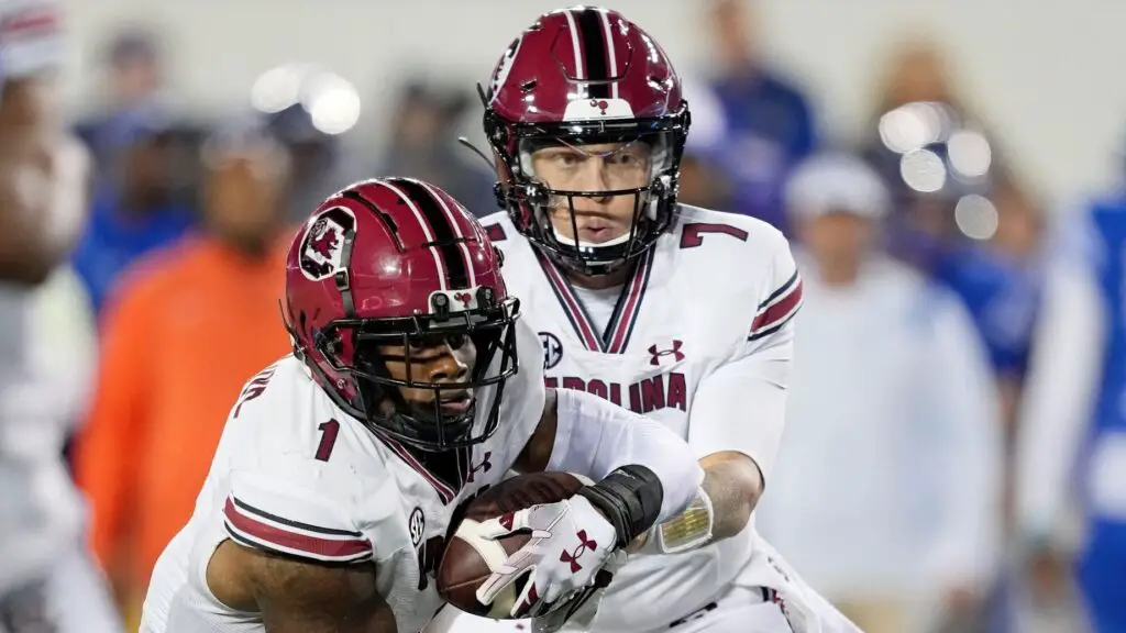 South Carolina Gamecocks quarterback Spencer Rattler hands off the football to MarShawn Lloyd in the first quarter against the Kentucky Wildcats