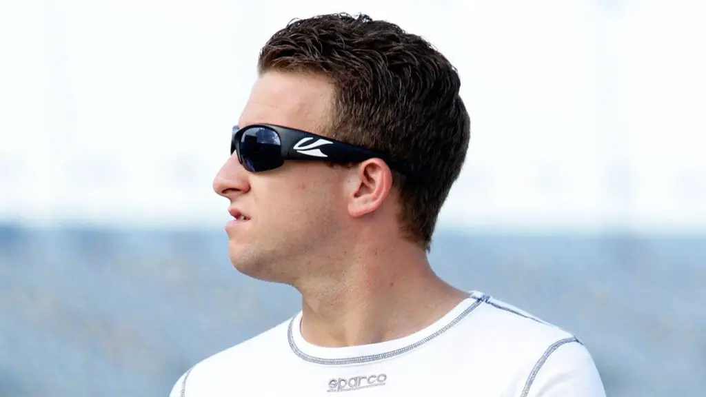 Former NASCAR Cup Series driver A.J. Allmendinger walks the grid during qualifying for the NASCAR Cup Series Coke Zero 400 Powered by Coca-Cola