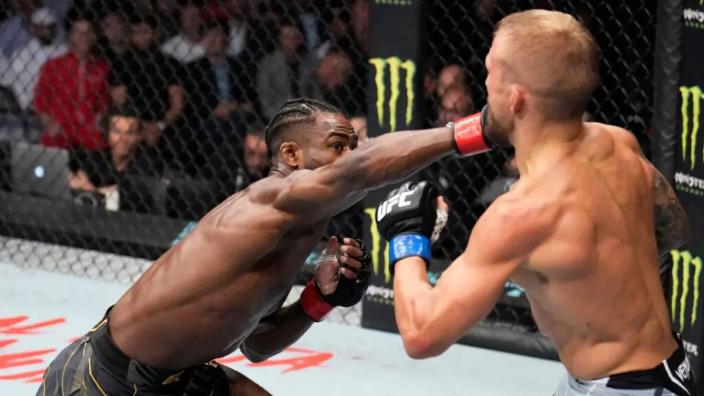 UFC fighter Aljamain Sterling punches TJ Dillashaw in their UFC bantamweight championship fight during their UFC 280 fight