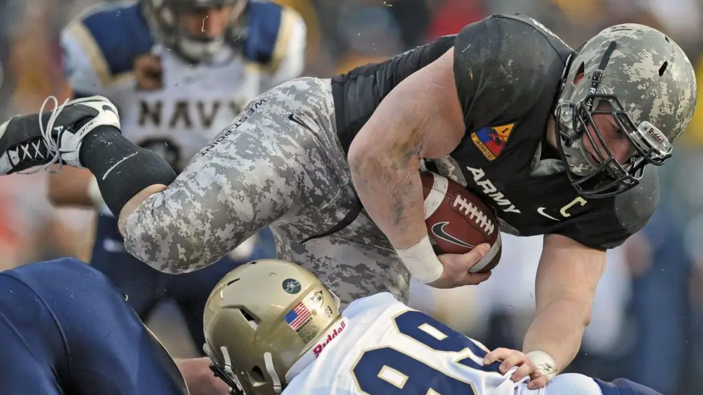 Army Black Knights fullback Collin Mooney dives for extra yardage during the 109th edition of the Army-Navy Game