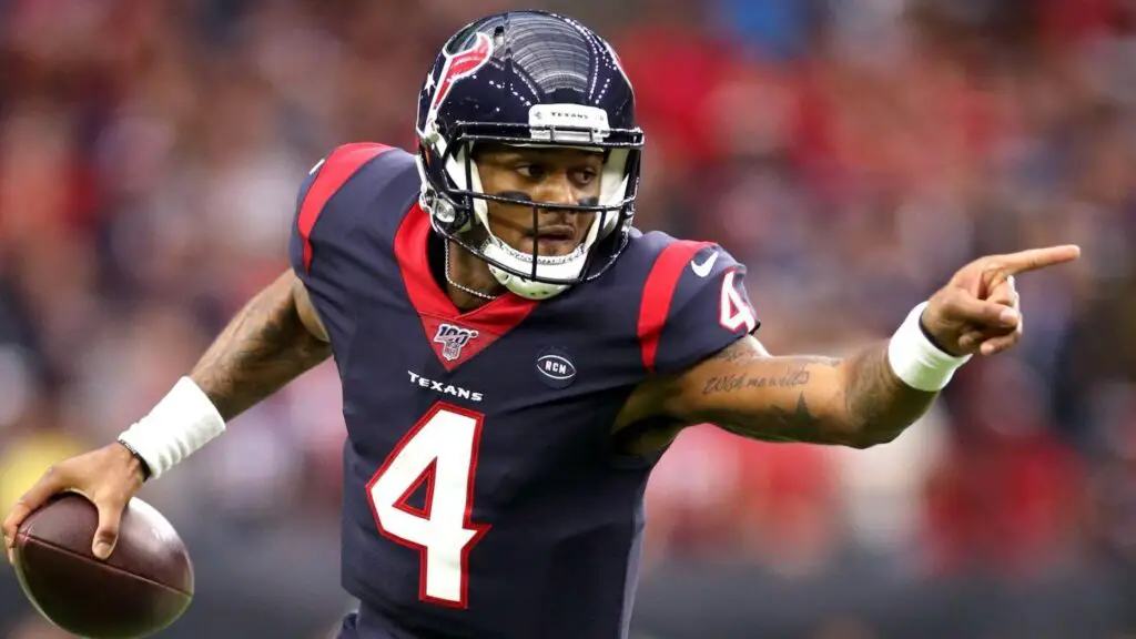 Houston Texans quarterback Deshaun Watson runs with the football against the Buffalo Bills during the first quarter of the AFC Wild Card Playoff Game