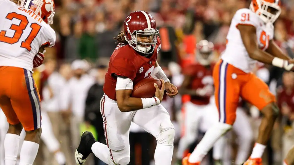 Alabama Crimson Tide quarterback Jalen Hurts runs with the football against the Clemson Tigers in the 2017 College Football Playoff National Championship game