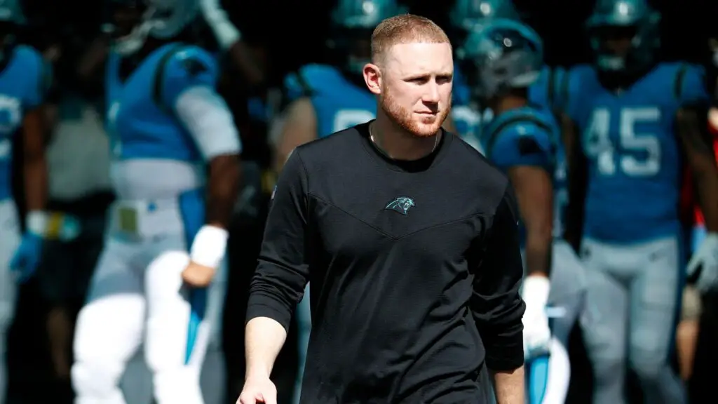 Former Carolina Panthers offensive coordinator Joe Brady walks the field before the game against the Miami Dolphins
