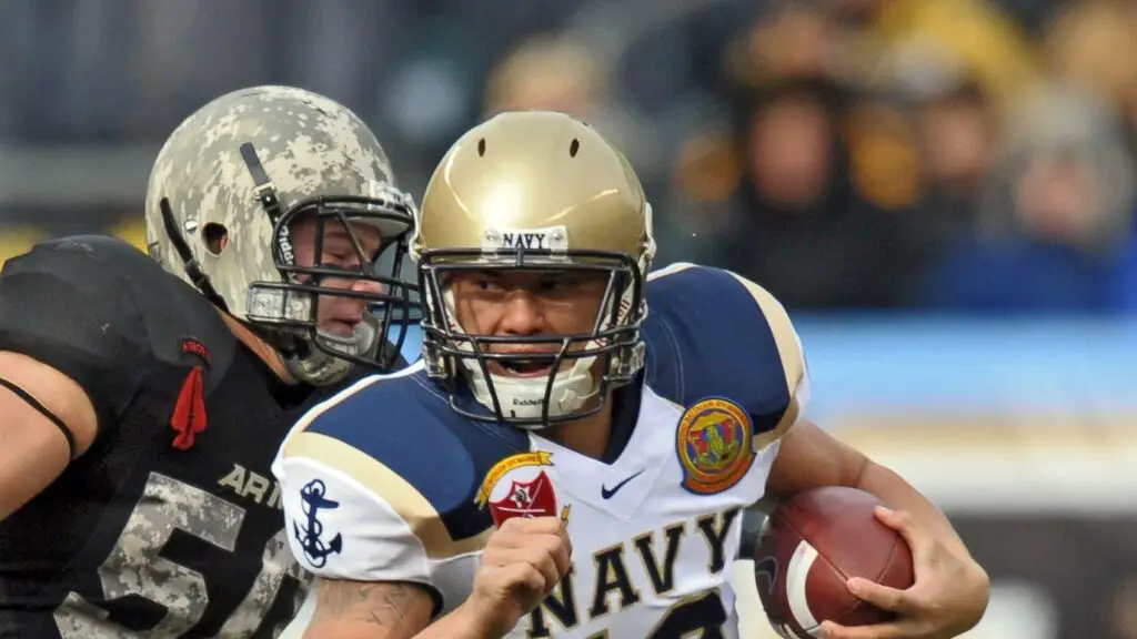 Navy Midshipmen quarterback Kaipo-Noa Kaheaku-Enhada runs with the football during the 109th edition of the Army-Navy Game