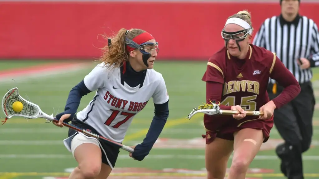 Former Stony Brook star lacrosse player Kylie Ohlmiller going to the net against Denver Pioneers