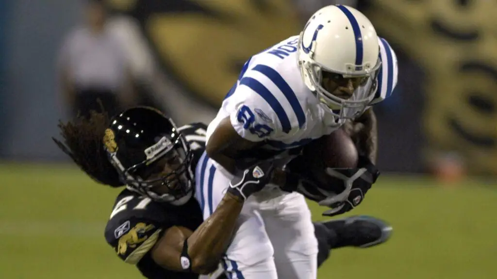 Indianapolis Colts wide receiver Marvin Harrison grabs a pass against the Jacksonville Jaguars