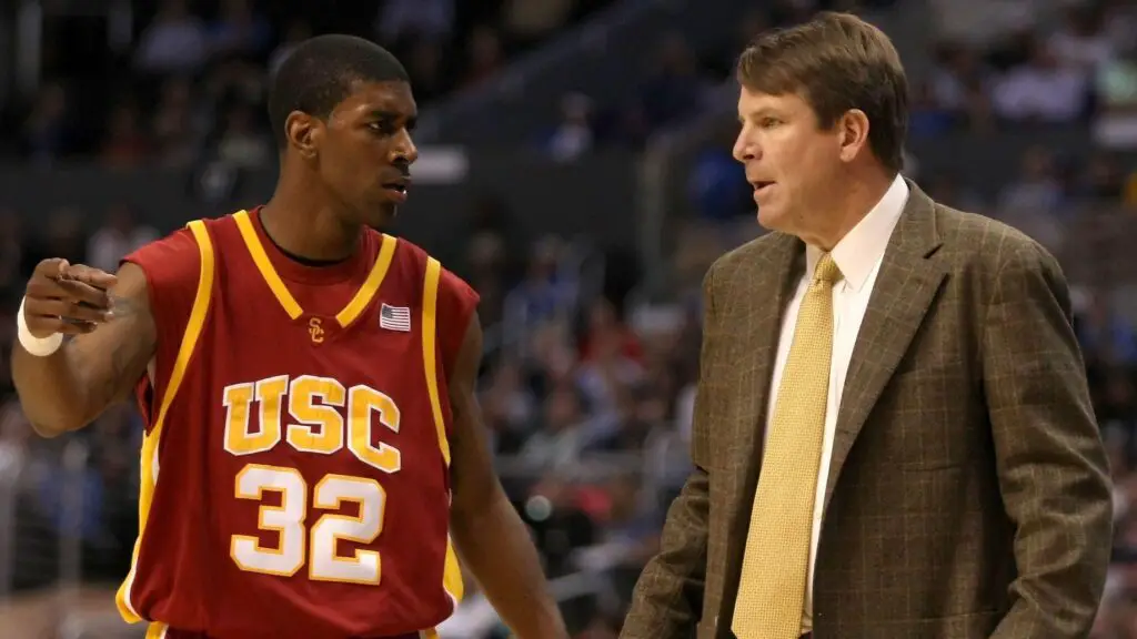 USC Trojans star O.J. Mayo talks to head coach Tim Floyd on the sidelines during the semifinals of the 2008 Pacific Life Pac-10 Men's Basketball Tournament Day Three against the UCLA Bruins