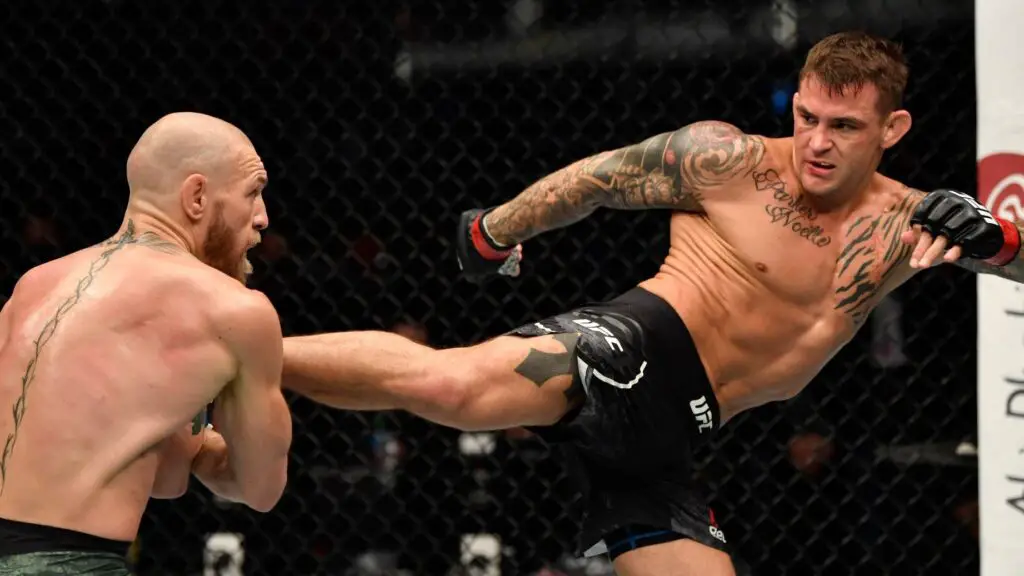 UFC fighter Dustin Poirier kicks Conor McGregor during their lightweight fight during the UFC 257 card