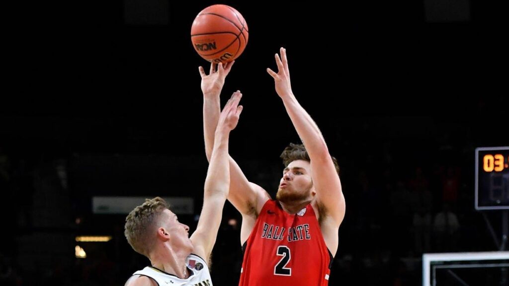 Ball State Cardinals guard Tayler Persons makes the game-winning shot over Notre Dame Fighting Irish guard Rex Pflueger late in the game