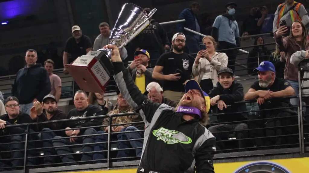 Race car driver Anthony Sesely celebrates his 2023 TQ Midget Championship after winning his fourth Gamblers Classic