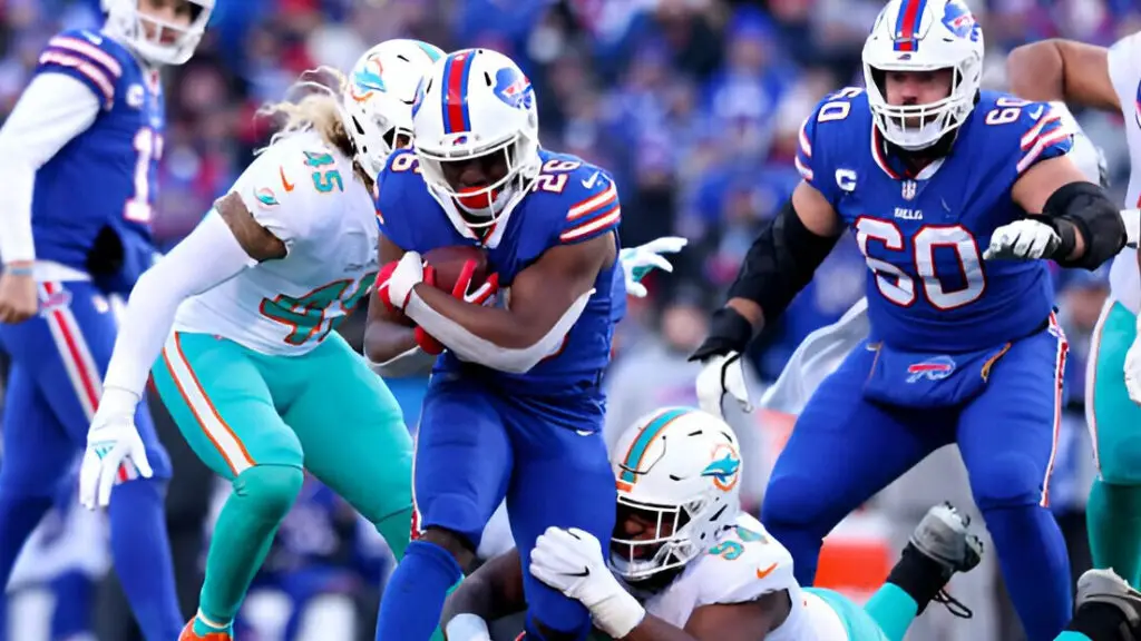 Buffalo Bills running back Devin Singletary carries the ball against the Miami Dolphins during the second half of the AFC Wild Card playoff game