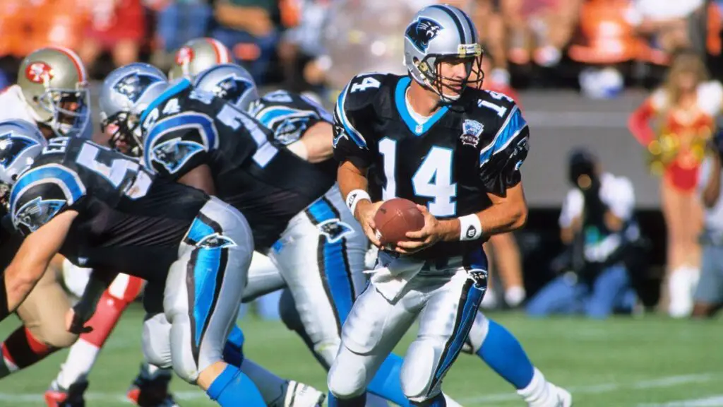Carolina Panthers quarterback Frank Reich takes the snap against the San Francisco 49ers in a preseason game