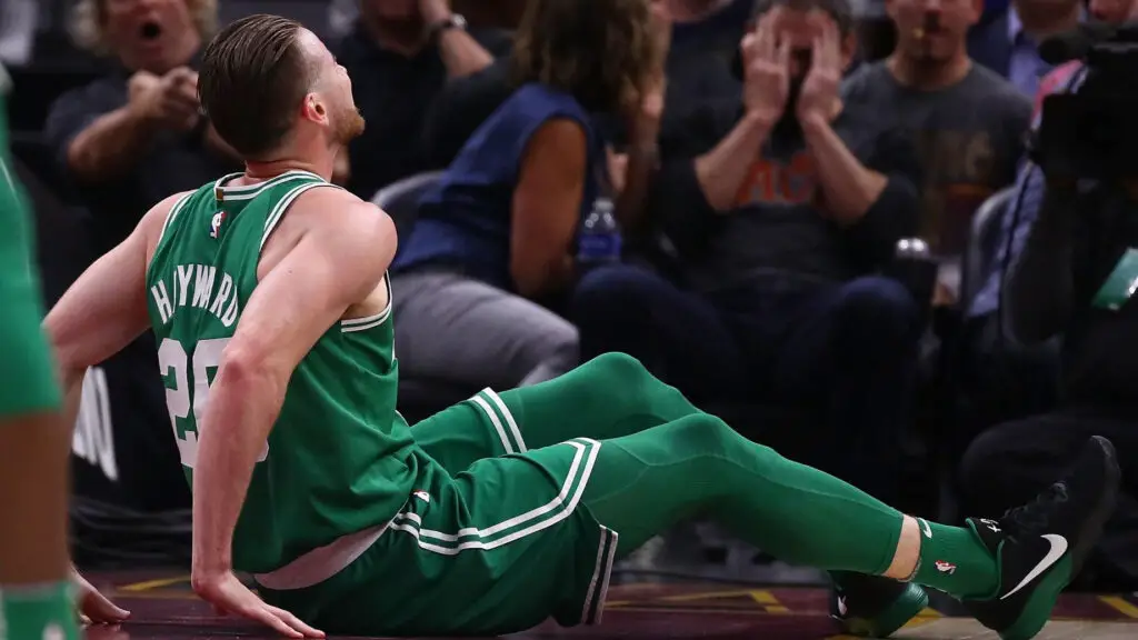 Boston Celtics forward Gordon Hayward sits on the floor after being injured while playing the Cleveland Cavaliers