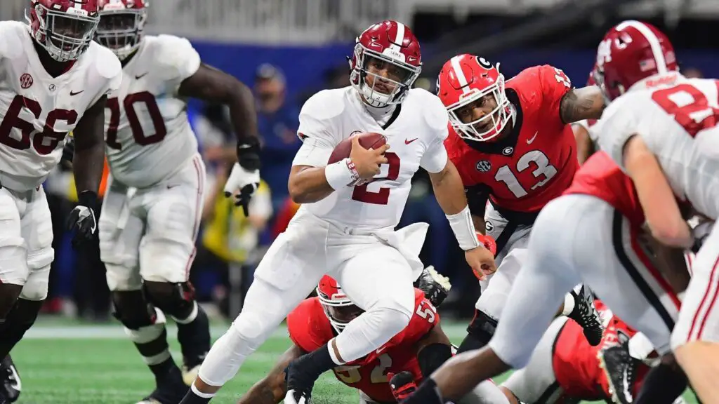 Alabama Crimson Tide quarterback Jalen Hurts carries the ball in the fourth quarter against the Georgia Bulldogs during the 2018 SEC Championship Game