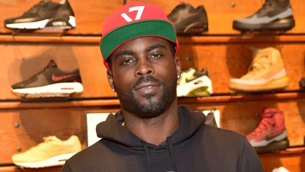 Former NFL quarterback Michael Vick attends the Michael Vick Charity Shoe Giveaway 