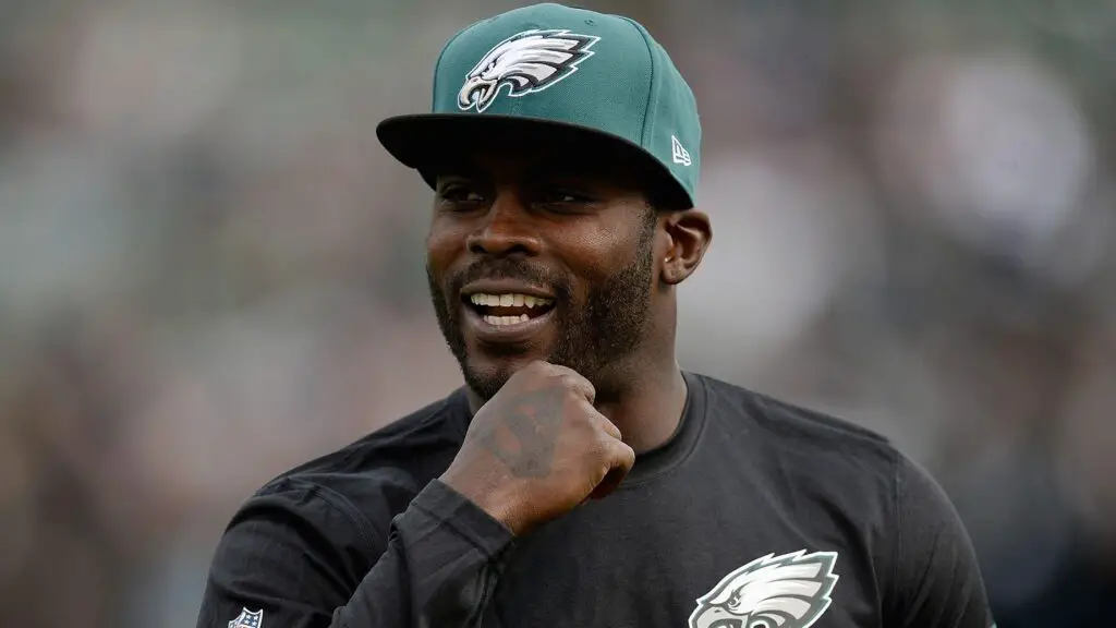 Philadelphia Eagles quarterback Michael Vick, who is not in uniform for today's game against the Oakland Raiders, looks on during pre-game warm-ups