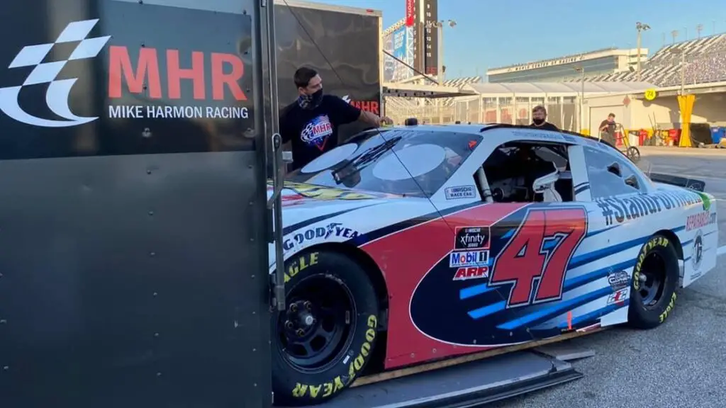 NASCAR No. 47 Xfinity Series car being unloaded before a race at a race track