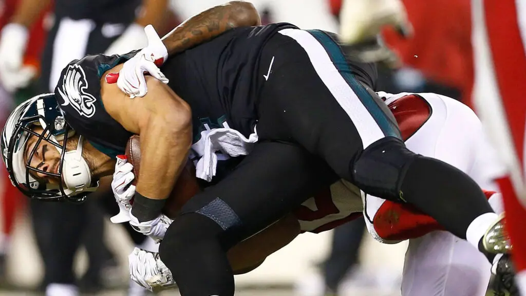 Philadelphia Eagles wide receiver Riley Cooper is tackled to the ground after making a reception in the third quarter against the Arizona Cardinals