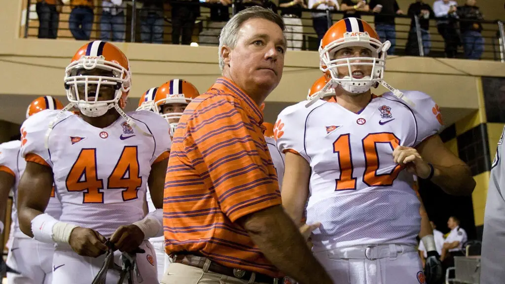 Former Clemson Tigers head coach Tommy Bowden waits with quarterback Cullen Harper and the rest of the Tigers prior to taking the field against the Wake Forest Demon Deacons