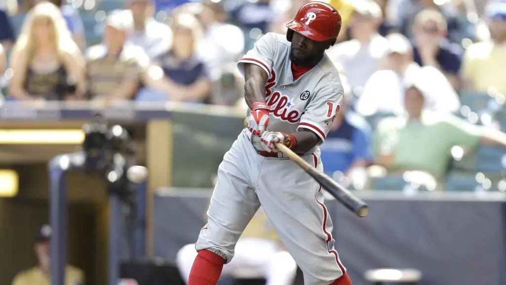 Philadelphia Phillies outfielder Tony Gwynn Jr. makes contact at the plate against the Milwaukee Brewers