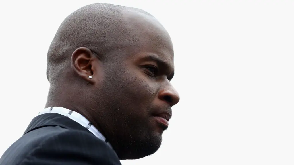 Former Texas Longhorns quarterback Vince Young watches a game between the Oklahoma Sooners and the Texas Longhorns