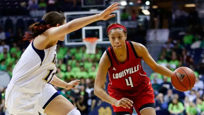 Louisville Cardinals player Antonita Slaughter drives to the basket against Natalie Achonwa against the Notre Dame Fighting Irish