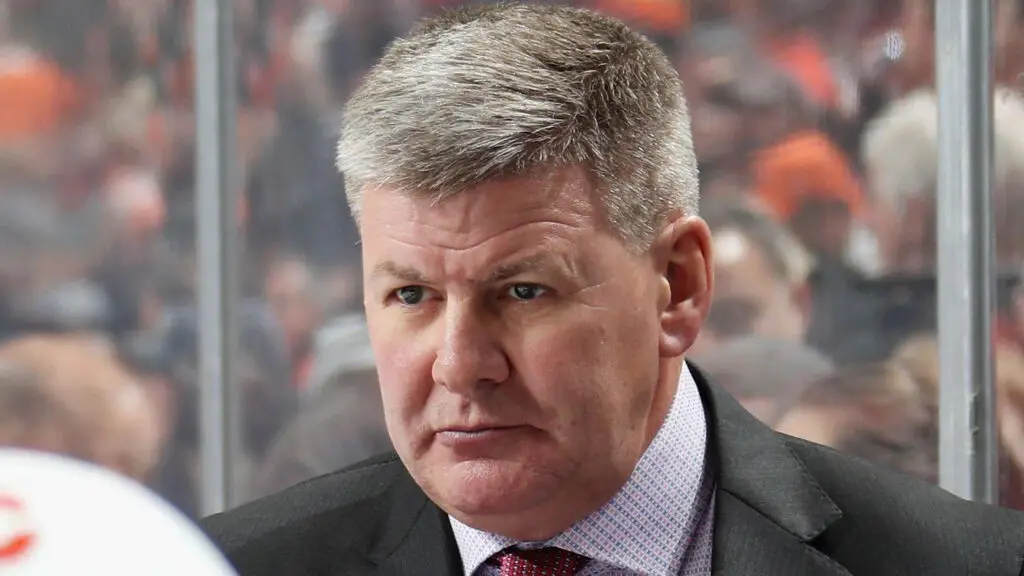 Former Calgary Flames head coach Bill Peters looks on during his team's game against the Philadelphia Flyers