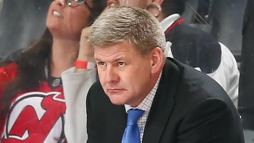 Former Carolina Hurricanes Head Coach Bill Peters looks on during the game against the New Jersey Devils