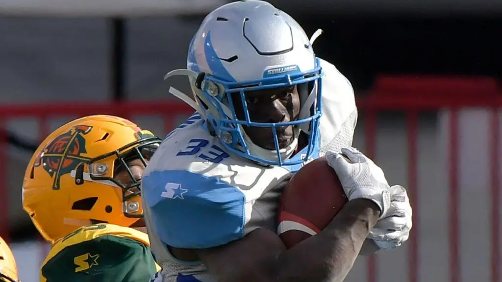 Salt Lake Stallions running back Branden Oliver is tackled by Nyles Morgan against the Arizona Hotshots during an Alliance of American Football game