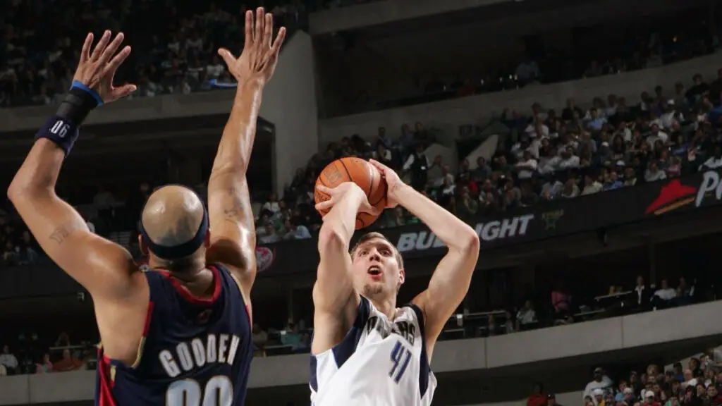 Dallas Mavericks star Dirk Nowitzki attempts a jump shot over Drew Gooden against the Cleveland Cavaliers