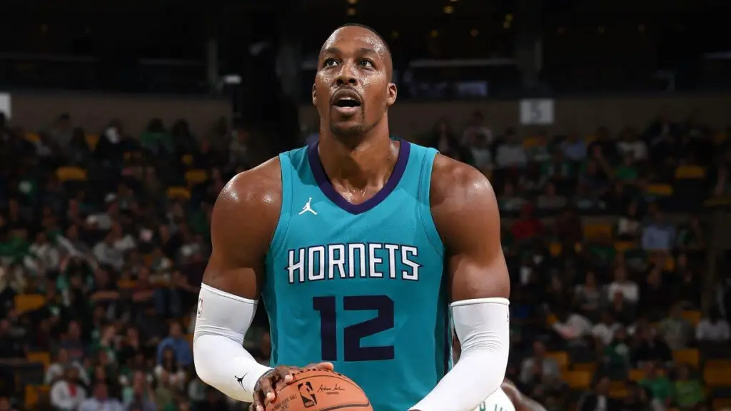 Charlotte Hornets center Dwight Howard shoots a free throw against the Boston Celtics during a preseason game
