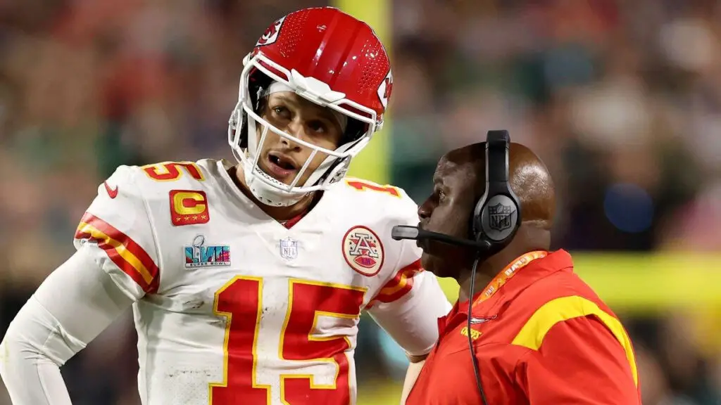 Kansas City Chiefs offensive coordinator Eric Bieniemy talks with star quarterback Patrick Mahomes during the fourth quarter against the Philadelphia Eagles in Super Bowl LVII