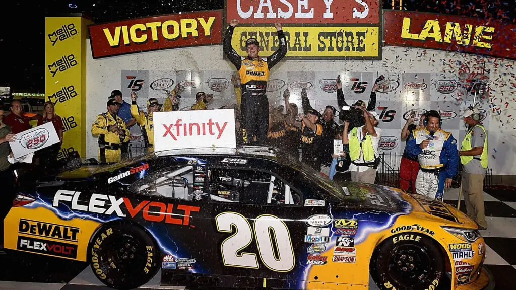 NASCAR driver Erik Jones celebrates in Victory Lane after winning the NASCAR XFINITY Series U.S. Cellular 250 