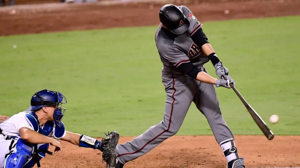 Arizona Diamondbacks outfielder J.D. Martinez hits a two-run home run against the Los Angeles Dodgers, his fourth home run of the game, to take a 13-0 lead during the ninth inning