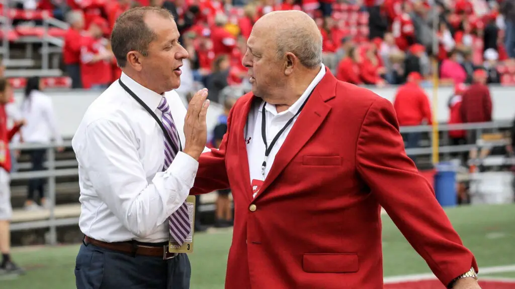 Former Northwestern University Athletic Director James J. Phillips and University of Wisconsin Athletic Director Barry Alvarez meet before the game between the Northwestern Wildcats and Wisconsin Badgers