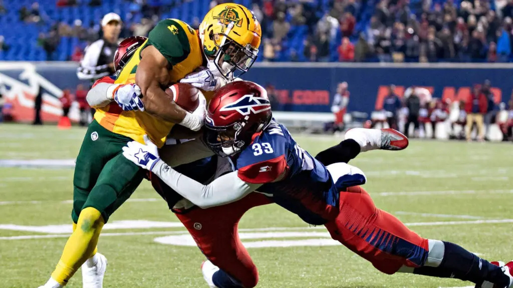 Arizona Hotshots running back Jhurell Pressley runs the football and is tackled by Justin Martin against the Memphis Express 