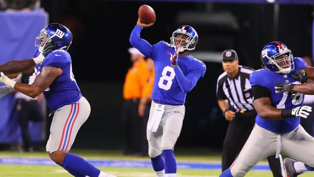 Former New York Giants quarterback Josh Johnson attempts a pass against the New York Jets during their NFL preseason game