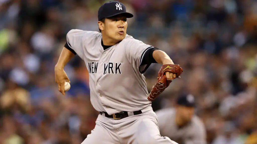 New York Yankees pitcher Masahiro Tanaka throws a pitch against the Seattle Mariners