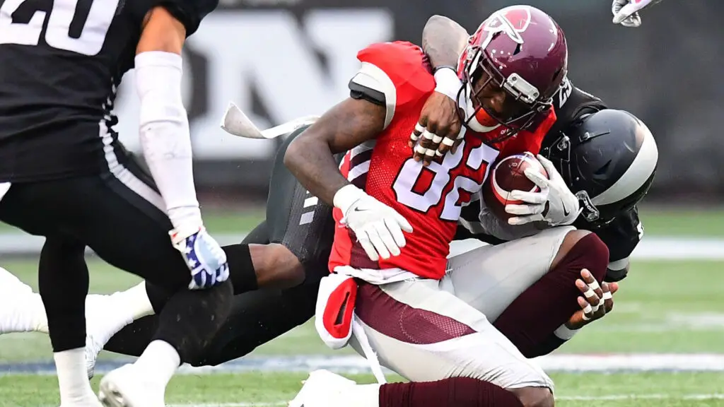 San Antonio Commanders wide receiver Mekale McKay is tackled by Jonathan Massaquoi against the Birmingham Iron during the first half in an Alliance of American Football game